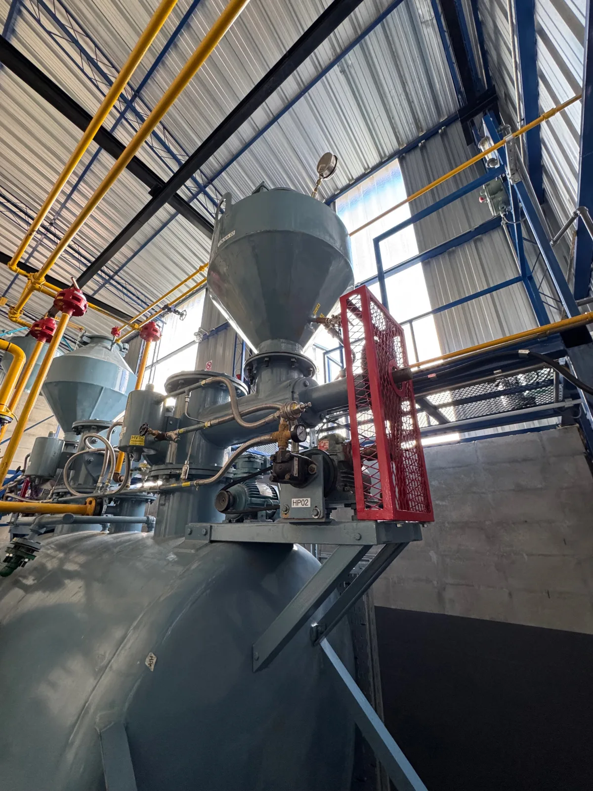 Interior of a KIGL acetylene plant showing the generator vessel and conical carbide charging hoppers