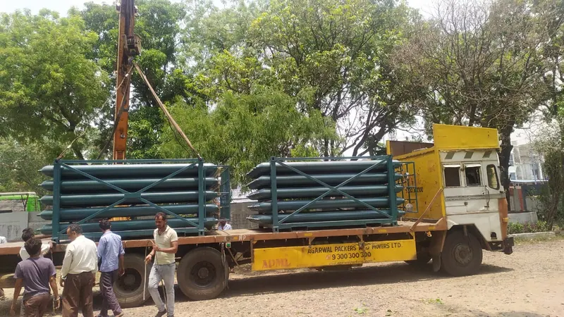 Gas cylinders secured in cradles on a dispatch truck ready for road delivery