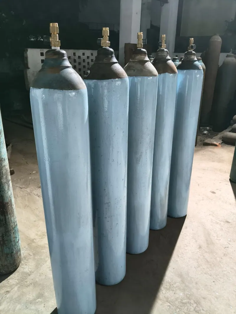 Freshly painted industrial gas cylinders showing identification colours before filling